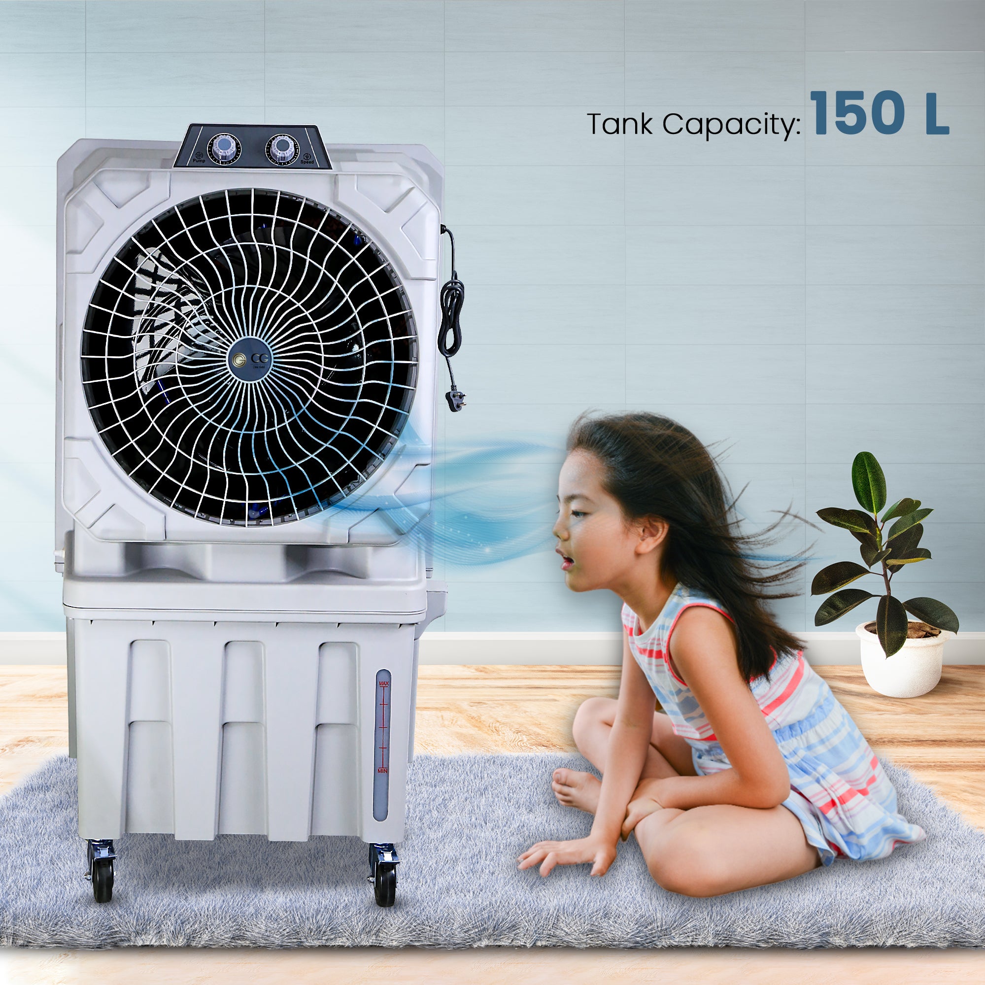 A portable desert air cooler with a honeycomb cooling pad, displayed in a room with a child sitting in front of it. The air cooler has a light grey finish and prominent wheels for mobility, and it indicates a 150 L tank capacity.