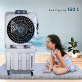 A portable desert air cooler with a honeycomb cooling pad, displayed in a room with a child sitting in front of it. The air cooler has a light grey finish and prominent wheels for mobility, and it indicates a 150 L tank capacity.